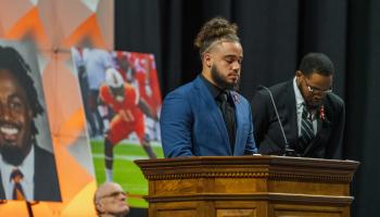 Cody Brown, a UVA running back, closes his eyes in a moment of silence as he honors his friend, Devin Chandler. (Photo by Erin Edgerton, University Communications)
