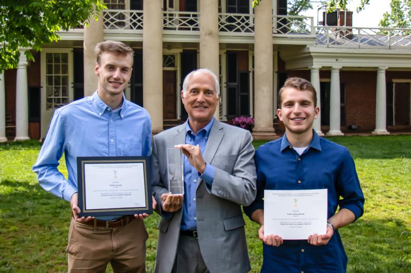 From left, Robby Keogh, media studies professor (and former CBS News correspondent) Wyatt Andrews and Yahya Abou-Ghazala celebrate the students’ Emmy for coverage of the “March for Our Lives” rally at UVA. 