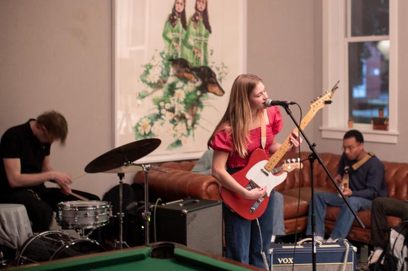 Fourth-year student Kate Bollinger performs with her band in March at Common House in Charlottesville.