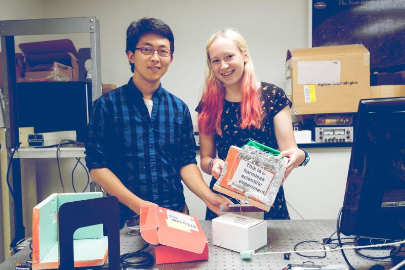 HeeSeok Joo, left, and Chloe Downs worked with physics student Nina Mazzarelli to design, build and fly an astronomy-related payload on a weather balloon.