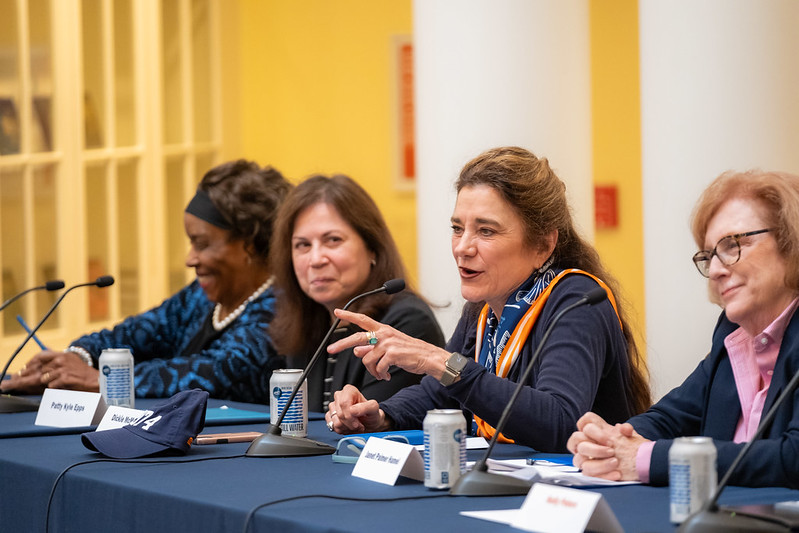 Class of '74 alumna Dickie McMullan (pointing) shares a story from her undergraduate years at UVA.