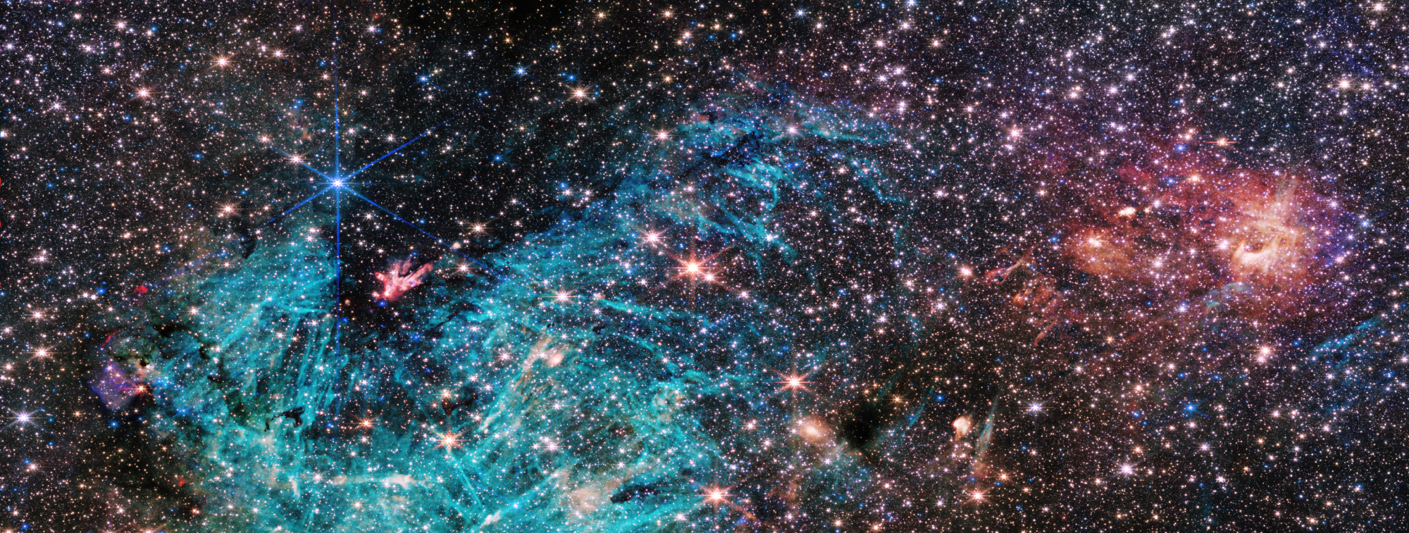 he full view of the James Webb Space Telescope’s NIRCam (Near-Infrared Camera) instrument reveals a 50 light-years-wide portion of the Milky Way’s dense center. An estimated 500,000 stars shine in this image of the Sagittarius C (Sgr C) region, along with some as-yet unidentified features. 