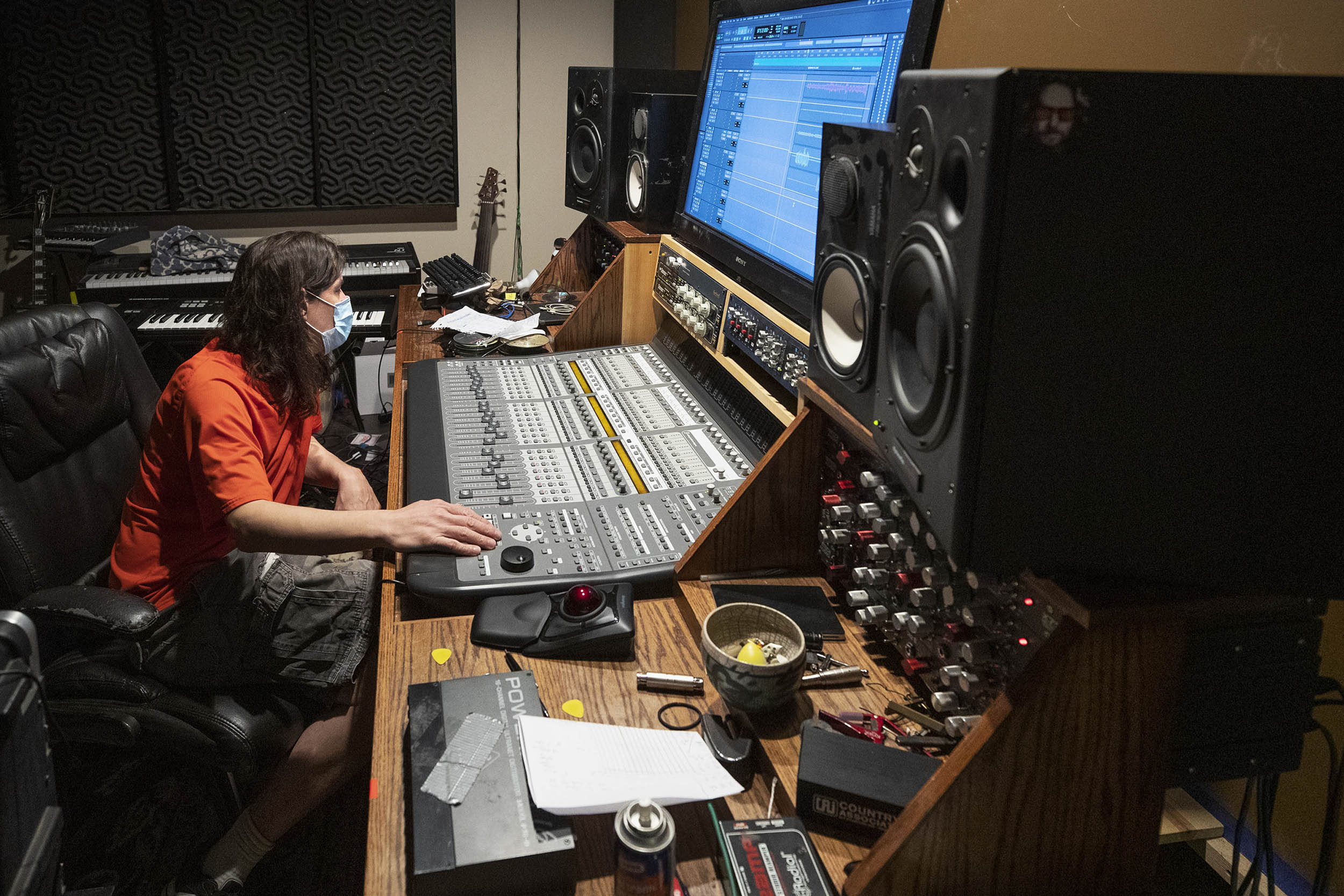 Mark Graham, owner of The Sound studio on Allied Street in Charlottesville, monitors the musicians at his soundboard.