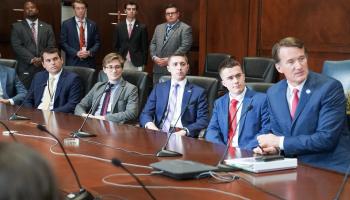 Gov. Glenn Youngkin, right, addresses office staff members. UVA student Cooper Cramer, seated to Youngkin’s right, interned in the Office of Transformation this summer. (Photo by Christian Martinez, Office of Gov. Glenn Youngkin)