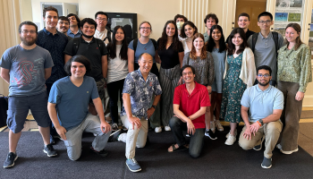 Ken Ono, UVA's Marvin Rosenblum Professor of Mathematics, and UCLA mathematician and Fields Medal winner Terence Tao (l to r, kneeling, front row center take a group photo with students in this summer's Research for Undergraduates program at UVA.