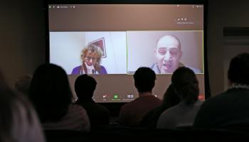 About two dozen students, faculty and staff gather in Newcomb Hall Tuesday to hear from a Palestinian father and an Israeli mother who have both lost loved ones to violence in the Middle East. They are part of a group urging dialogue as a path to peace.