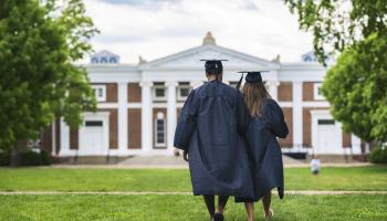 Students in graduation cap and gown UVA