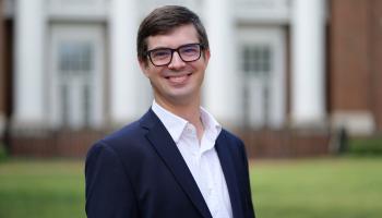 Portrait photo of Jonathan Colmer, associate professor of Economics, on UVA's Lawn.