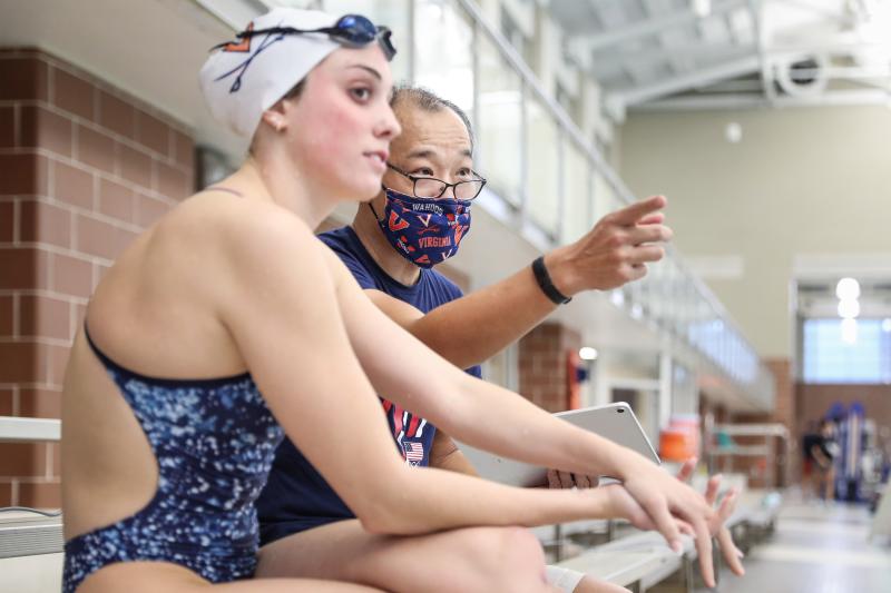 UVA math professor Ken Ono works with first-year UVA swimmer Emma Weyant, who won an Olympic silver medal in Tokyo last summer. (Photos by Matt Riley, UVA Athletics)