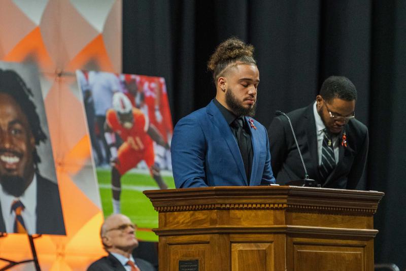 Cody Brown, a UVA running back, closes his eyes in a moment of silence as he honors his friend, Devin Chandler. (Photo by Erin Edgerton, University Communications)