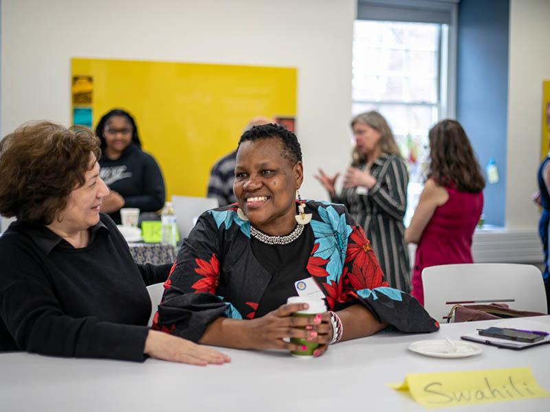 UVA Swahili instructor Leonora Anyango greets a colleague at the Consortium for Less Commonly Taught Languages' anniversary event.