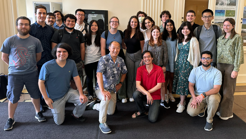Ken Ono, UVA's Marvin Rosenblum Professor of Mathematics, and UCLA mathematician and Fields Medal winner Terence Tao (l to r, kneeling, front-row center) take a group photo with students in this summer's Research for Undergraduates program at UVA.