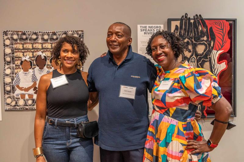 Cedric Rucker, interim senior associate vice president of student affairs and dean of students, poses for a photo with two of the contributing artists, Tobiah Mundt, left; and UVA professor Lisa Woolfork, right. 