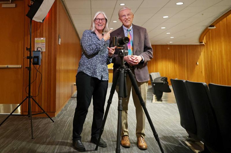 University Professor Ken Elzinga reunited with his former student, Nancy Andrews, when she returned to Grounds to take his portrait for the president’s office. 