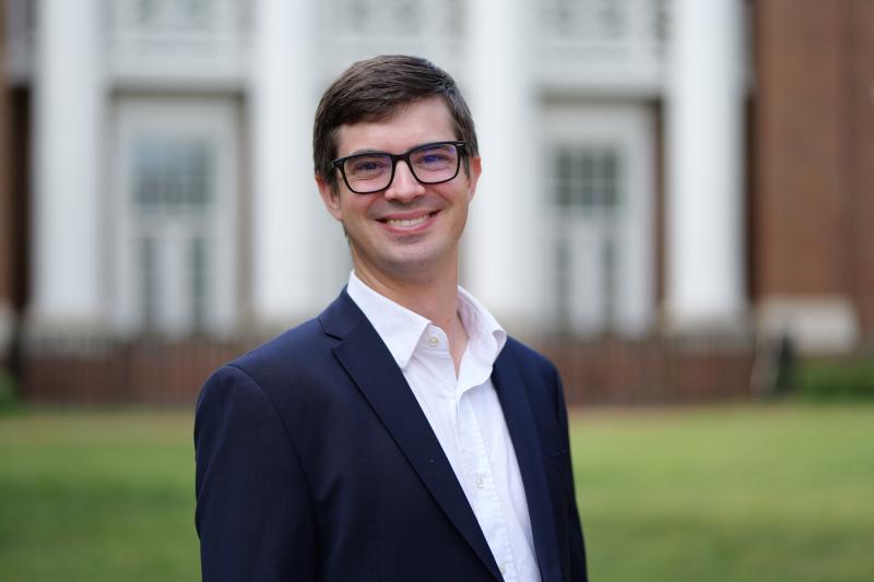 Portrait photo of Jonathan Colmer, associate professor of Economics, on UVA's Lawn.