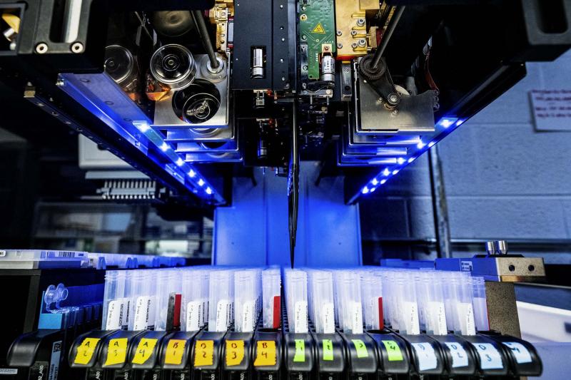 The Campbell Lab’s robot, now nicknamed “Rosie,” tests a plate of saliva specimens for coronavirus. 