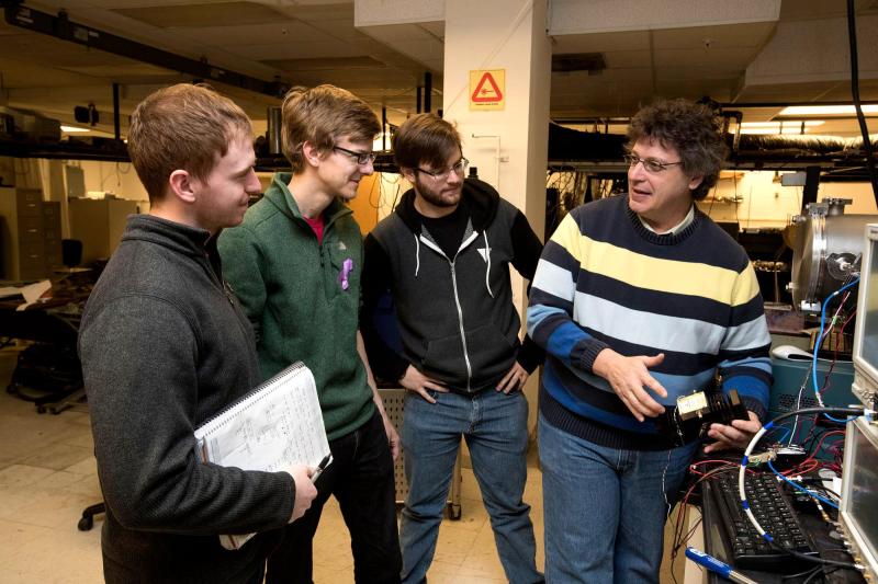Brooks Pate, right, works to pass on a sense of civic duty to the next generation of scientists.