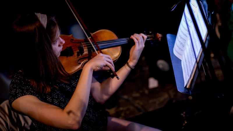 Violinist Becca Fredrick, shown here during the dress rehearsal, is one of 20 musicians playing in the opera’s pit orchestra. “The Pirates of Penzance” features 28 musical numbers that are by turns poignant, fast-paced and witty.