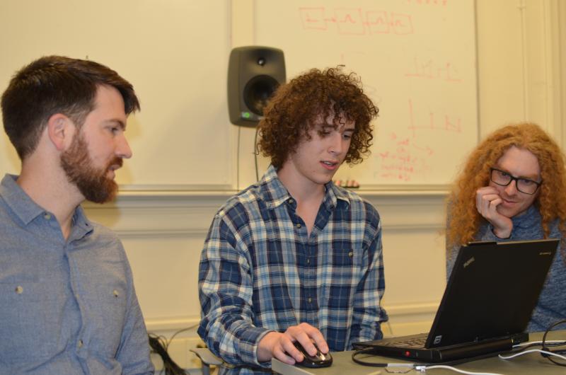 Assistant Professor of Music Luke Dahl (left) and TA Max Tfirn (right) observe an early draft of a student's final class project.