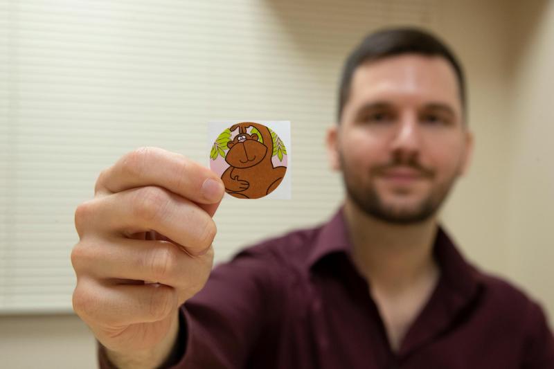 Beeler-Duden holds one of the coveted stickers used in the experiments.