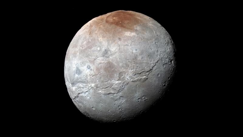 New Horizons captured this high-resolution, enhanced-color view of the moon Charon just before its closest approach on July 14.