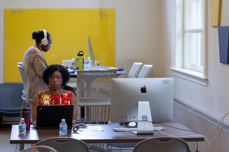 Althea Brooks, foreground, and other volunteers gathered at Minor Hall to transcribe copies of Julian Bond’s speeches, op-ed pieces and other works from UVA’s collection of his personal papers.