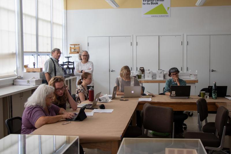 Susan Bro (seated, far left) and other volunteers at the Jefferson School transcribe digital copies of Julian Bond’s collected speeches and correspondence for UVA’s Papers of Julian Bond project.