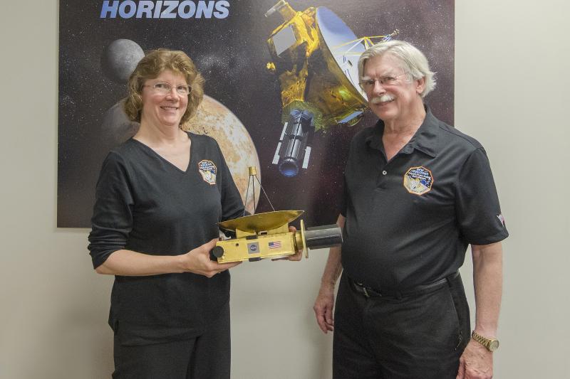 Research Associate Professor of Astronomy Anne Verbiscer and Professor of Environmental Sciences Alan Howard at mission control at the Johns Hopkins University Applied Physics Laboratory in Laurel, Maryland.