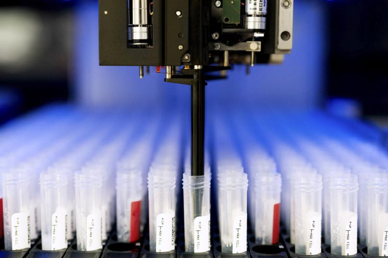 COVID Lab Rosie the robot at work pipetting a saliva specimen.