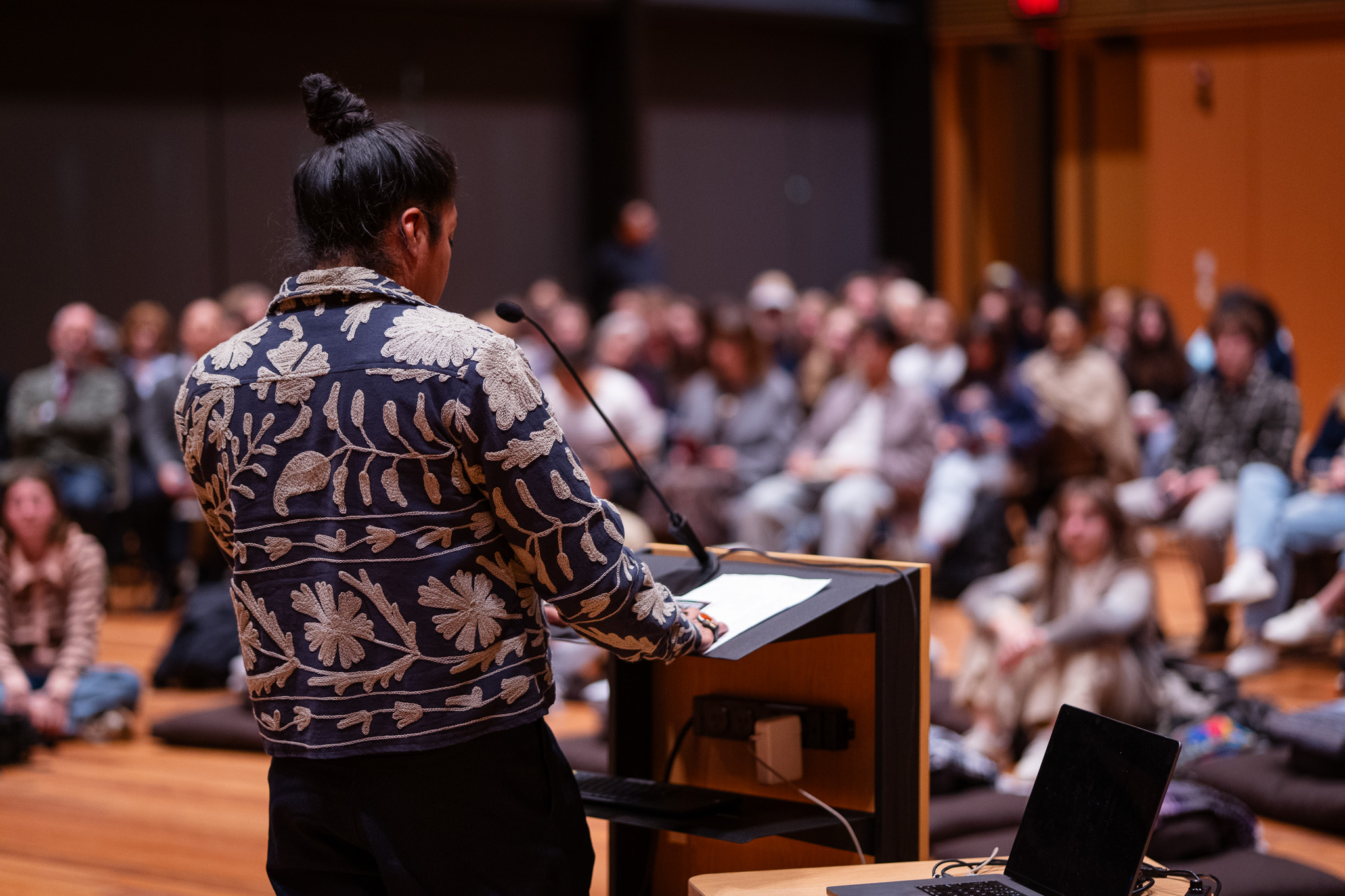 Federico Cuatlacuatl speaking to audience from lectern.