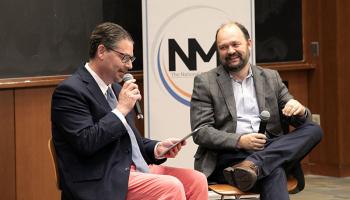 UVA professor Brad Wilcox and New York Times columnist Ross Douthat laughing together during a panel discussion.