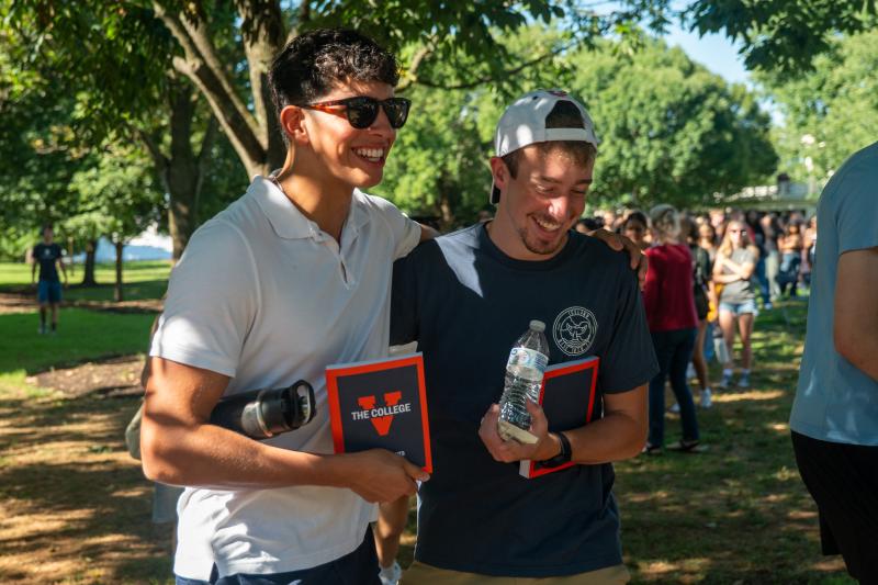 Two new UVA students walk on the Lawn together after the First Lecture.
