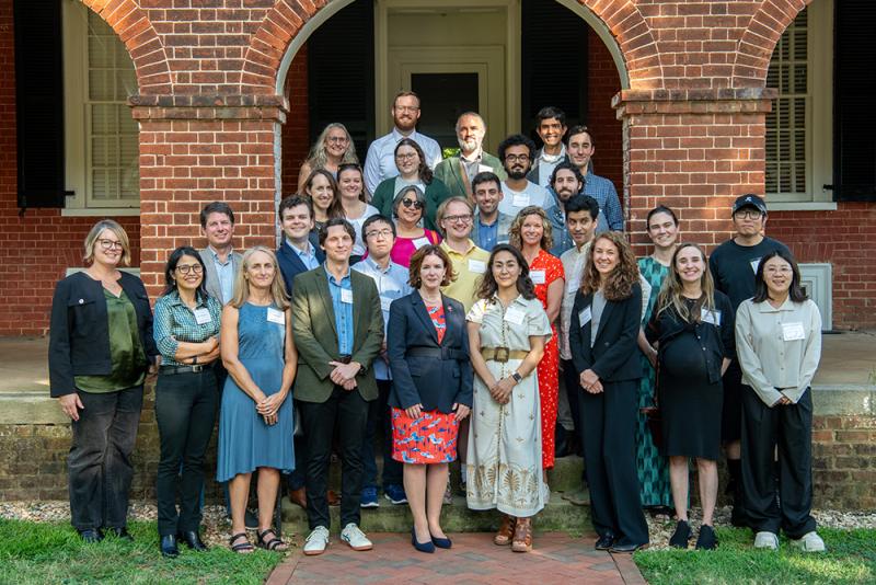 A group of new A&S faculty members pose for a group photo with A&S Dean Christa Acampora.