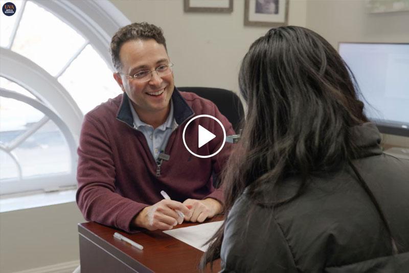 Professor advising student in an office setting